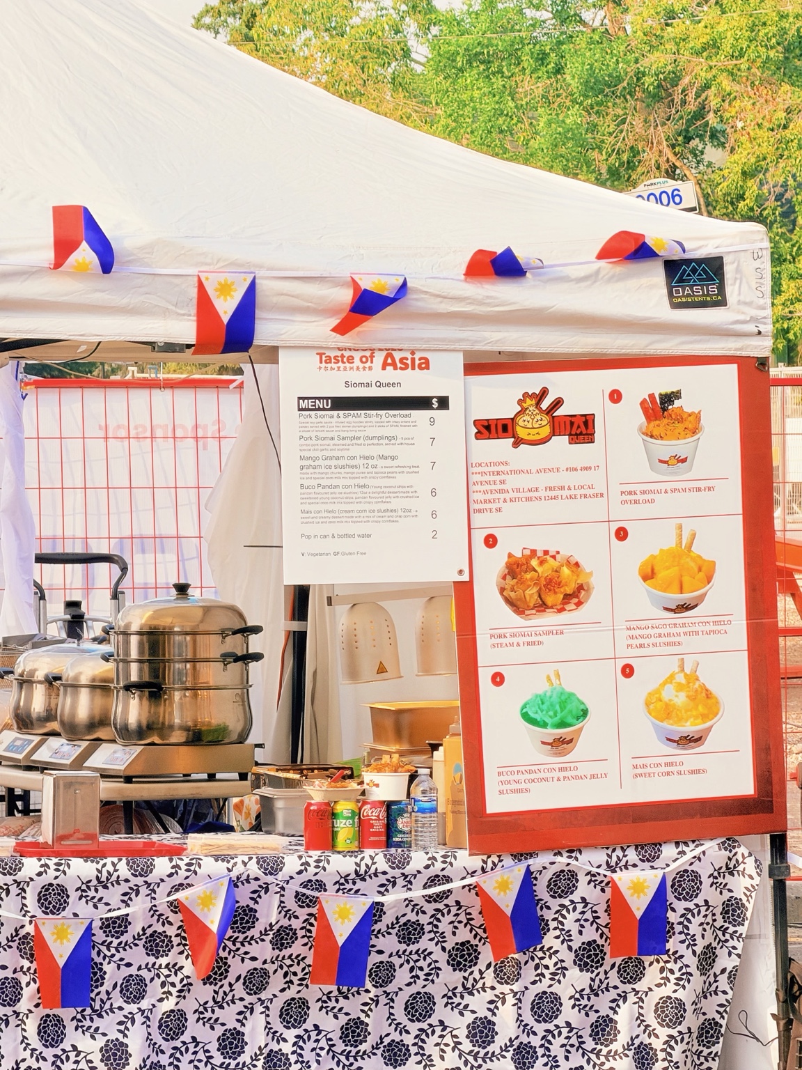 A Filipino food stall at Taste of Asia with its menu and national flags